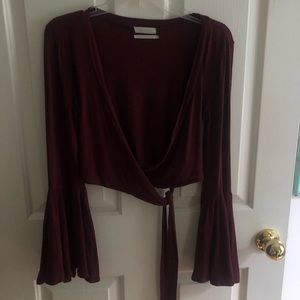 Low cut wrap top